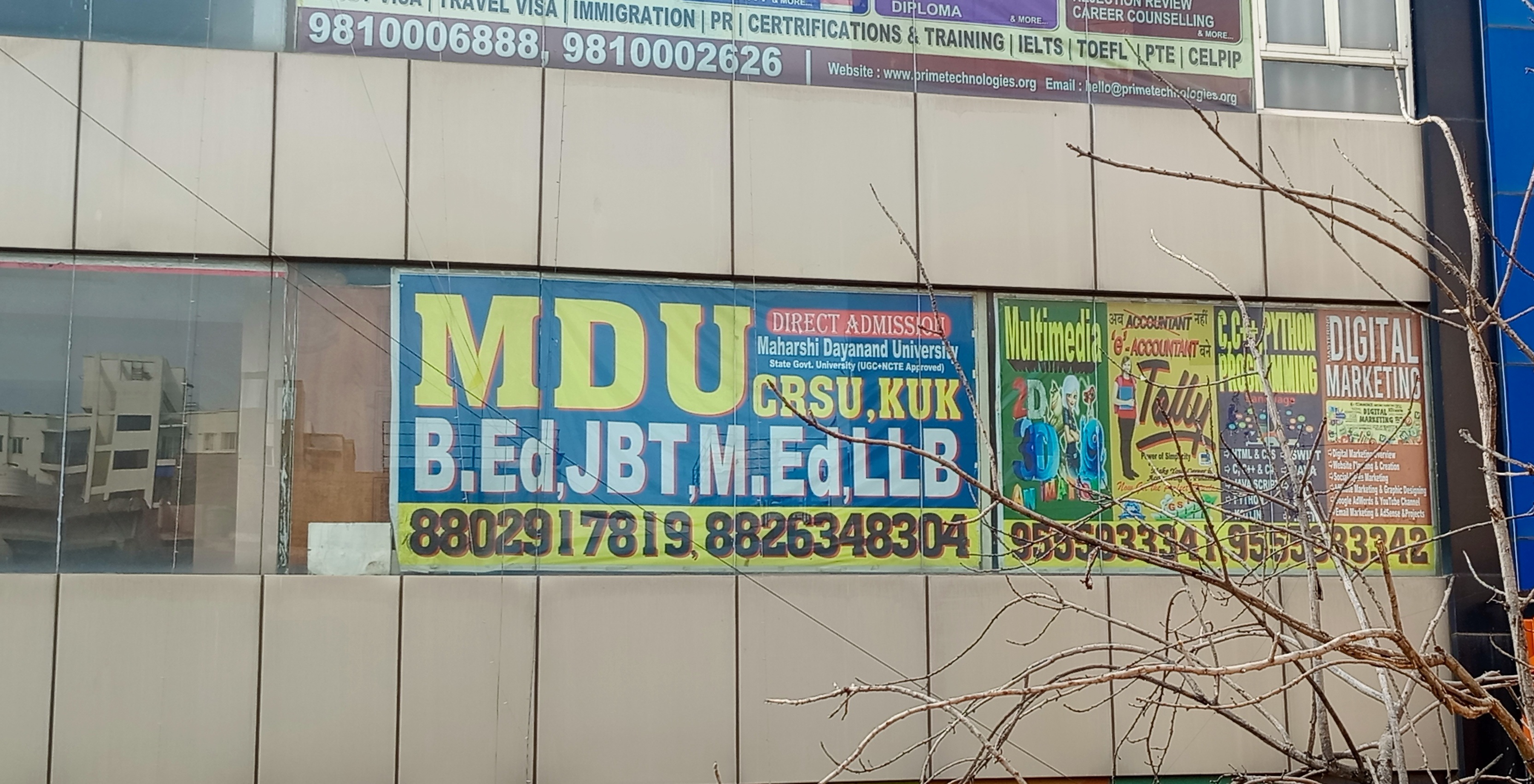 Poster of Expert Academy displayed on a public wall for advertisement